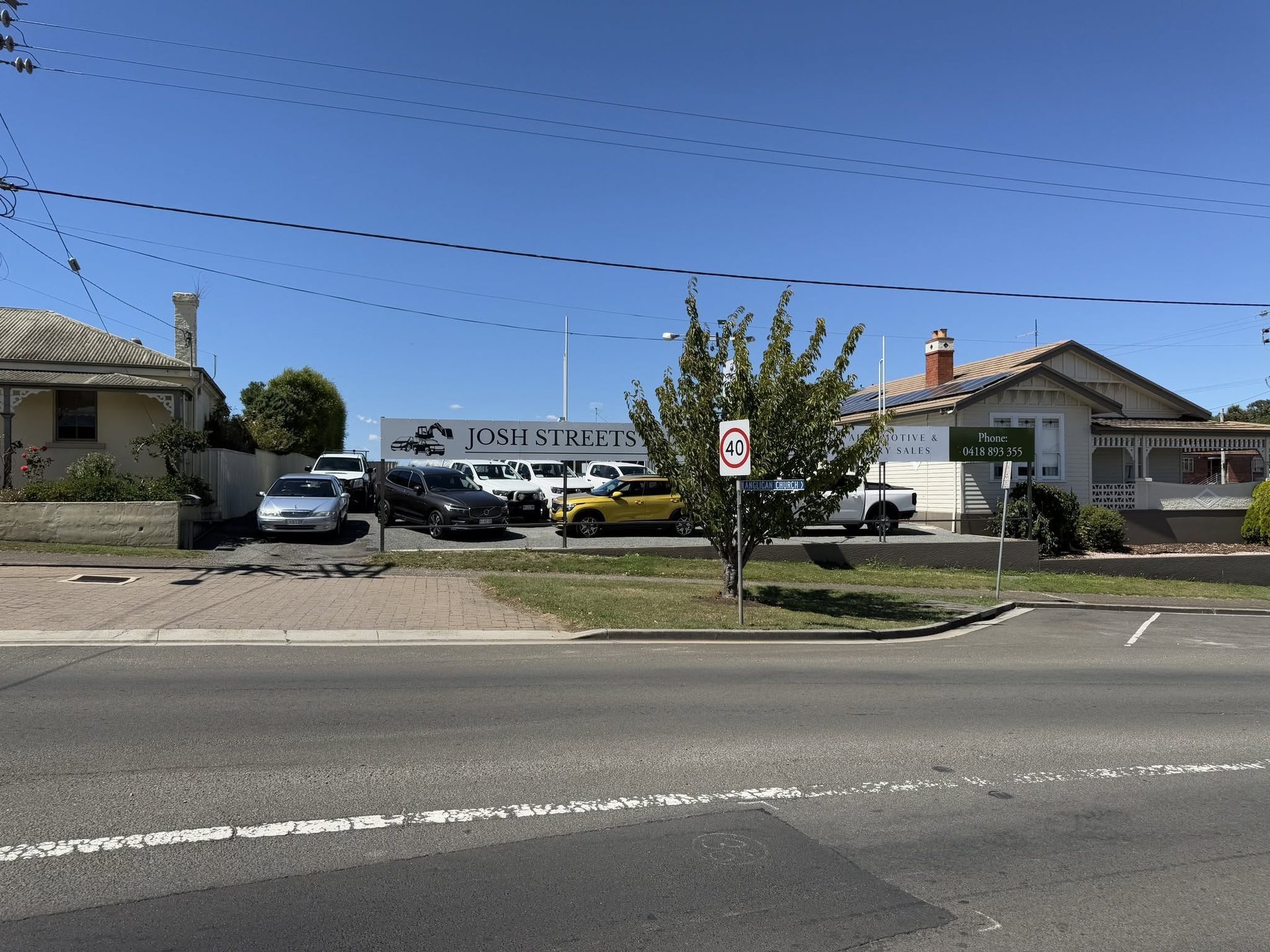 The Streets Automotives yard and signage seen from Emu Bay Road